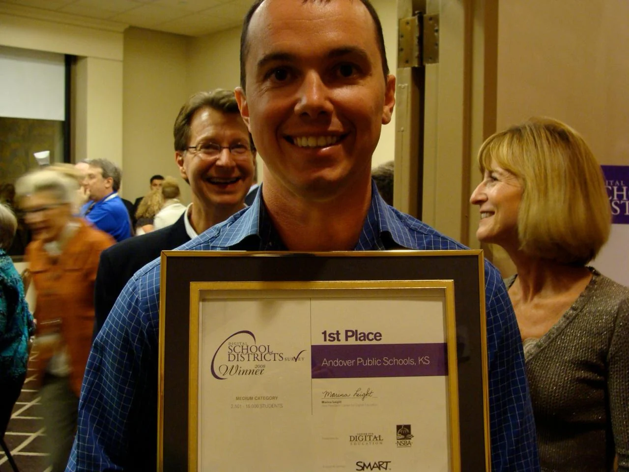 Rob holding the framed 2008 Digital School Districts Survey Winner certificate: 1st Place, Andover Public Schools, KS, medium category, 2,501 to 15,000 students.
