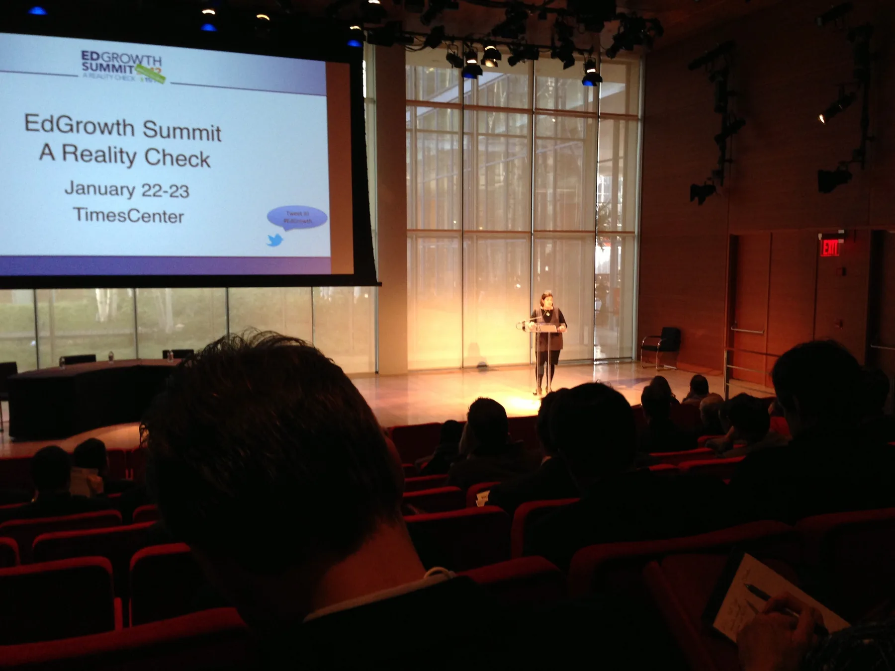 EdGrowth Summit title slide on the screen at the TimesCenter: "A Reality Check, January 22-23."