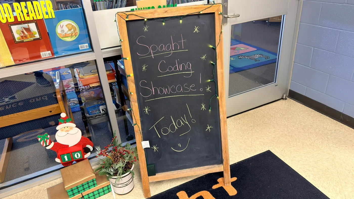 Chalkboard sign reading Spaght Coding Showcase Today